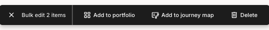 A Bulk edit bar reading Bulk edit 2 items, with Add to portfolio, Add to journey map, and Delete actions.