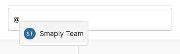 A comment composer with an @ typed in it. A dropdown below the field lists a workspace member, Smaply Team, with their avatar, ready to be selected as a mention.